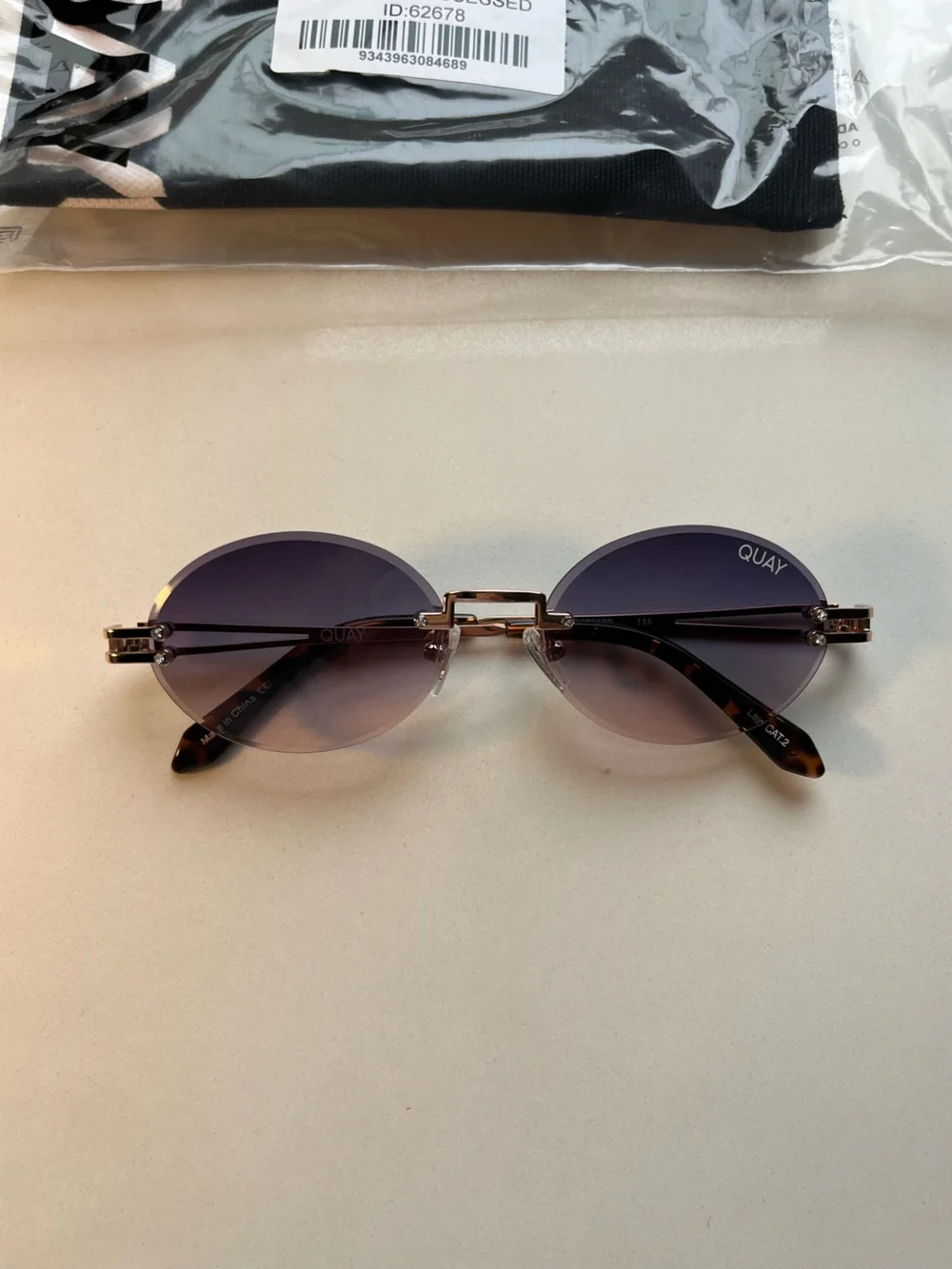QUAY Literally Obsessed Rimless Oval Sunglasses-Rose Gold/Blue Pink Fade Lens